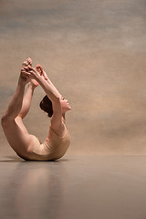 Image showing The female ballet dancer posing over gray background