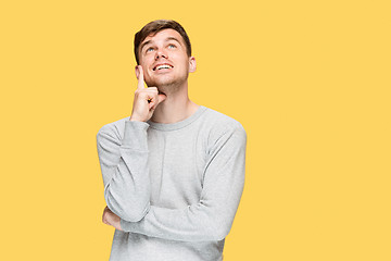 Image showing The young man smiling and looking up