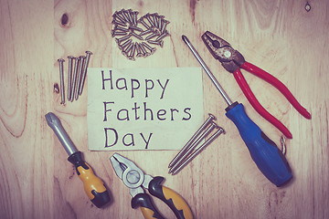 Image showing Set of different tools on wooden background