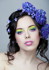 Image showing Beauty young woman with flowers and make up close up, real spring beauty girl floral