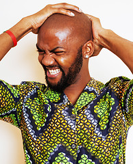 Image showing portrait of young handsome african man wearing bright green nati