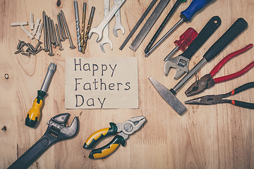 Image showing Set of different tools on wooden background