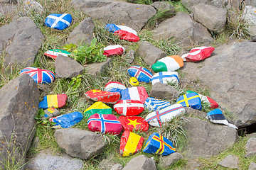 Image showing Painted pebbles with flags
