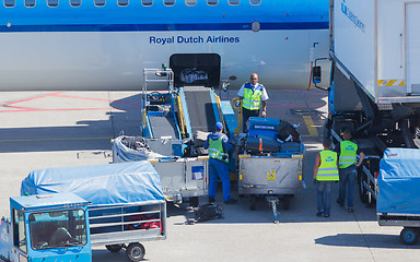 Image showing AMSTERDAM, NETHERLANDS - AUGUST 17, 2016: Loading luggage in air