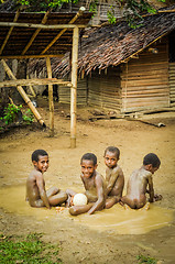 Image showing Naked boys in mud