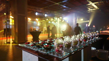 Image showing Beautifully decorated catering banquet table with different food snacks.