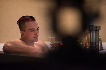 Image showing man relaxing in the jacuzzi