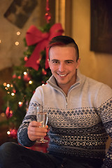 Image showing Happy young man with a glass of champagne