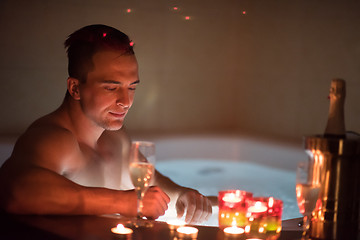 Image showing man relaxing in the jacuzzi