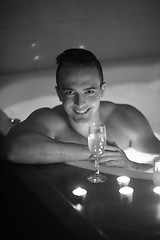 Image showing man relaxing in the jacuzzi