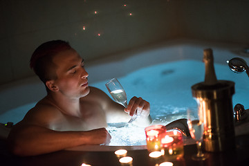 Image showing man relaxing in the jacuzzi