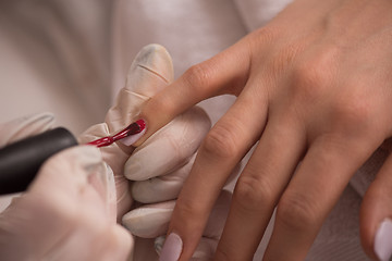 Image showing Woman hands receiving a manicure