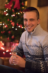 Image showing Happy young man with a glass of champagne