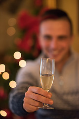 Image showing Happy young man with a glass of champagne