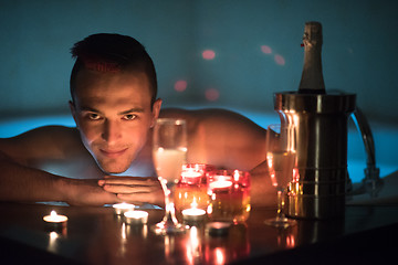 Image showing man relaxing in the jacuzzi