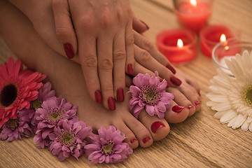 Image showing female feet and hands at spa salon