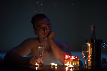 Image showing man relaxing in the jacuzzi