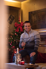 Image showing Happy young man with a glass of champagne