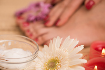 Image showing female feet and hands at spa salon