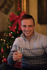 Image showing Happy young man with a glass of champagne