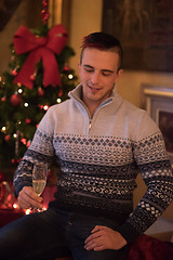 Image showing Happy young man with a glass of champagne