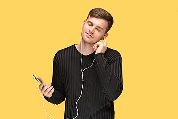 Image showing The young man smiling and looking away