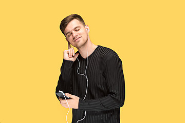 Image showing The young man smiling and looking away