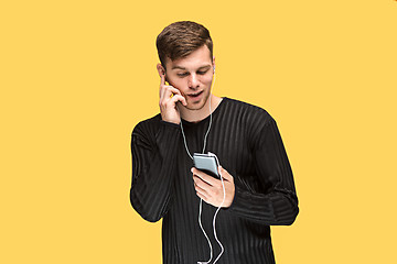 Image showing The young man smiling and looking away