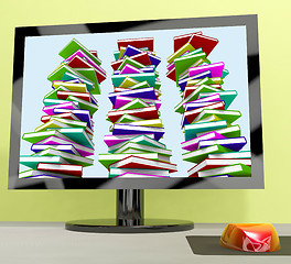 Image showing Three Stacks Of Books On Computer Shows Online Learning