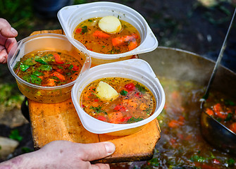 Image showing Hot soup in a tourist bowler on a picnic