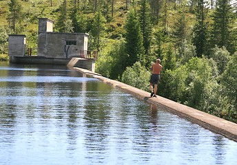 Image showing Man on an old dam