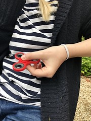 Image showing Girl holding popular new spinner gadget