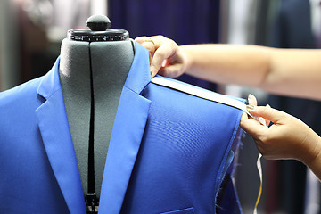 Image showing Men seamstress, a suit made to measure.