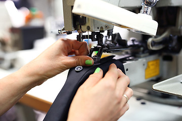 Image showing Seamstress on the machine.