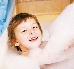 Image showing little cute boy in bathroom with bubbles close up smiling, lifes