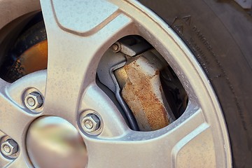 Image showing Wheel closeup with rusty brakediscs