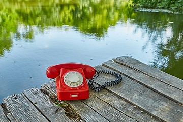 Image showing Old telephone in nature