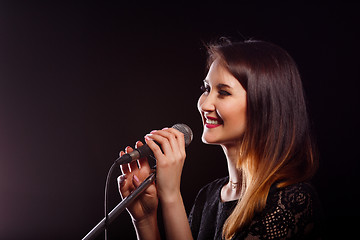 Image showing Photo of singer with microphone