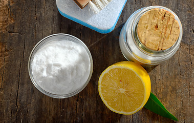 Image showing Tools with lemon and sodium bicarbonate on wood