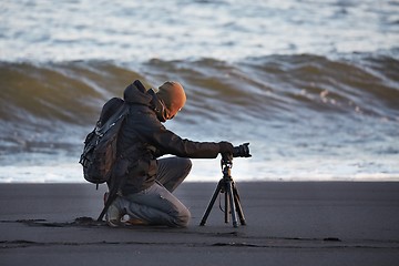 Image showing Photographer with tripod