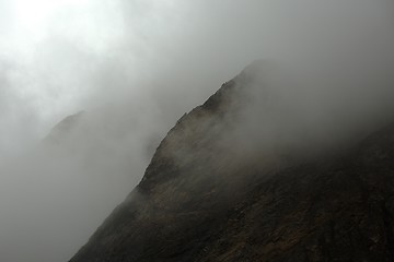 Image showing Mountain cliffs in fog