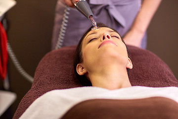 Image showing woman having hydradermie facial treatment in spa