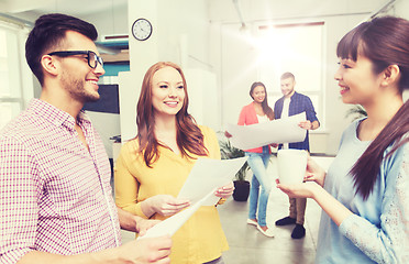 Image showing creative team on coffee break talking at office