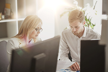 Image showing business team discussing papers at office table