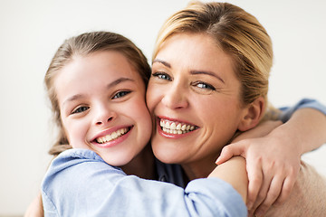 Image showing happy smiling family hugging