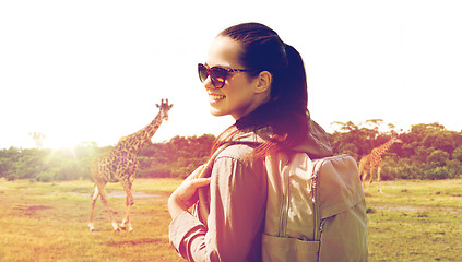 Image showing happy woman with backpack traveling in africa