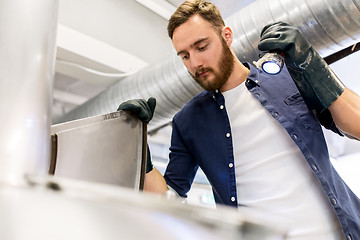 Image showing man working at craft brewery or beer plant