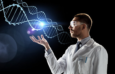 Image showing scientist in lab coat and safety glasses with dna