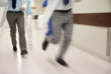 Image showing close up of medics or doctors running at hospital