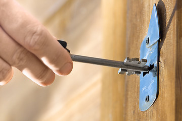 Image showing hands unlocking door, closeup